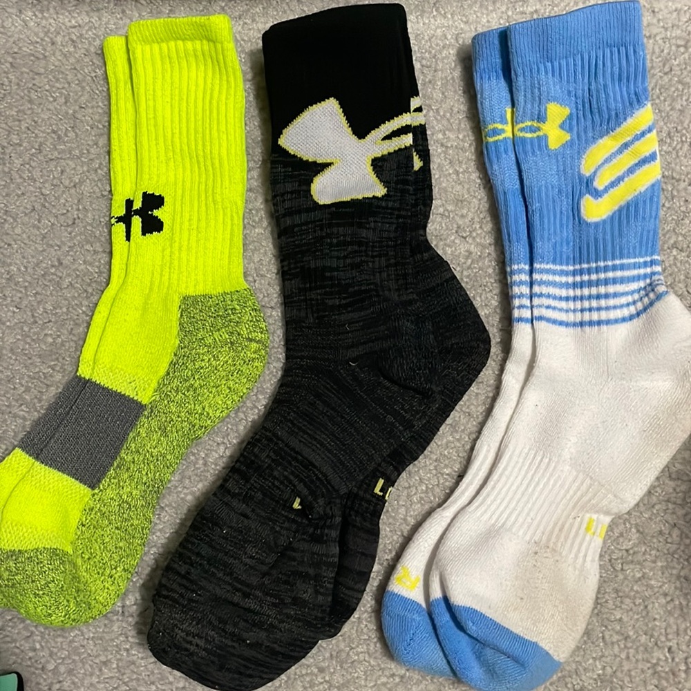 Available. Under Armour Socks 3 pairs.  Neon - Medium, Black and White - Larges